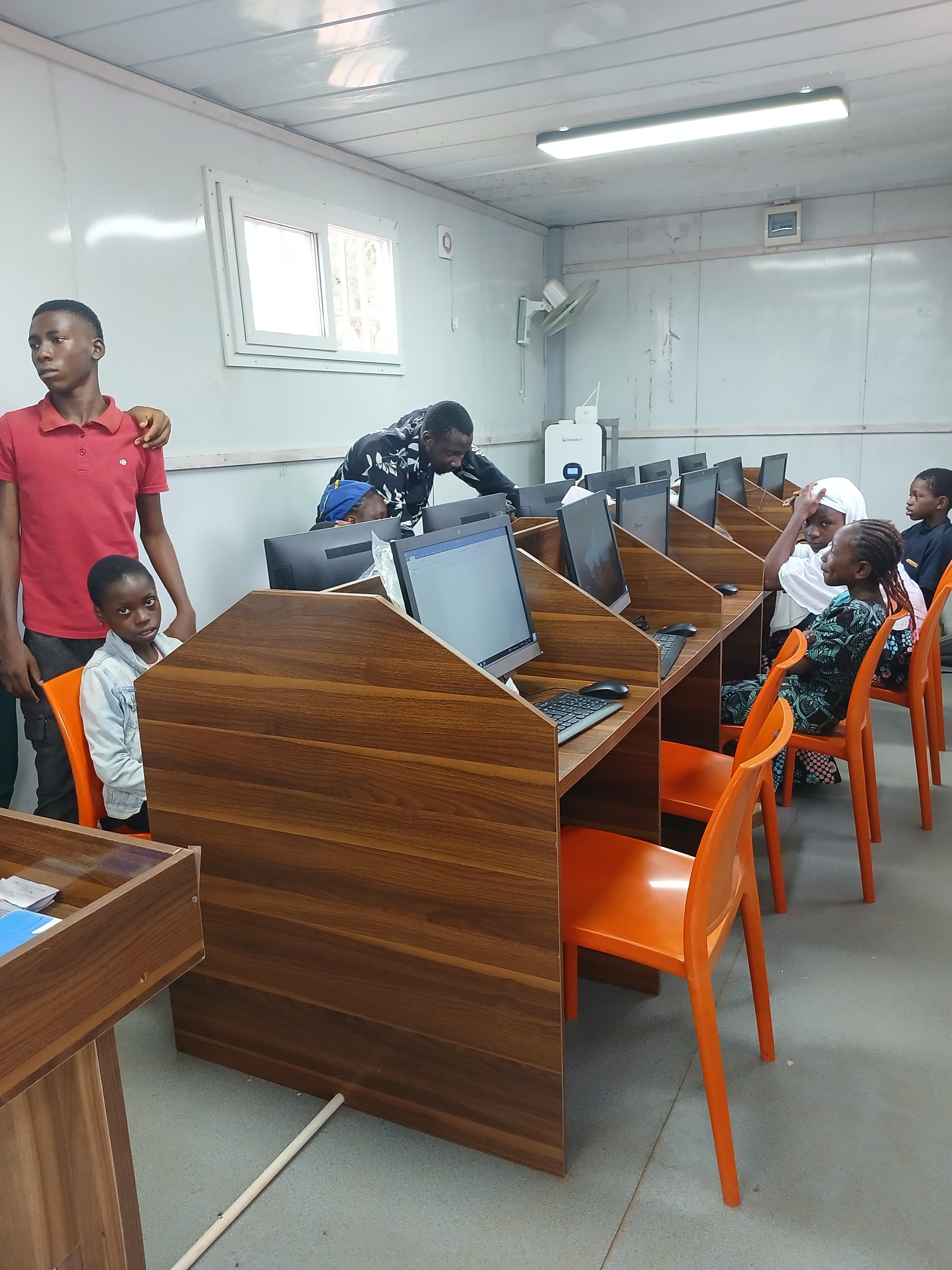 Learners using computers in a community lab