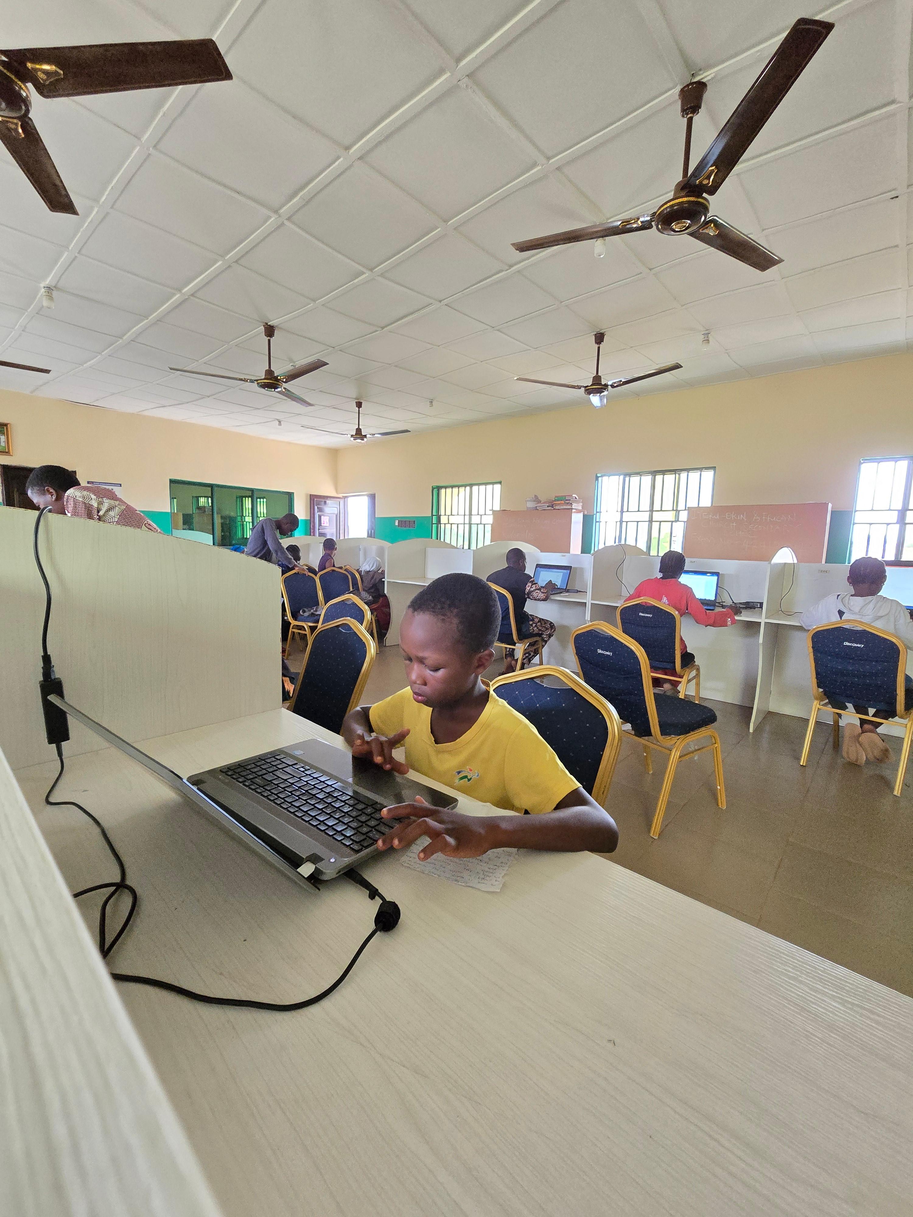 A student practising digital skills in a computer lab